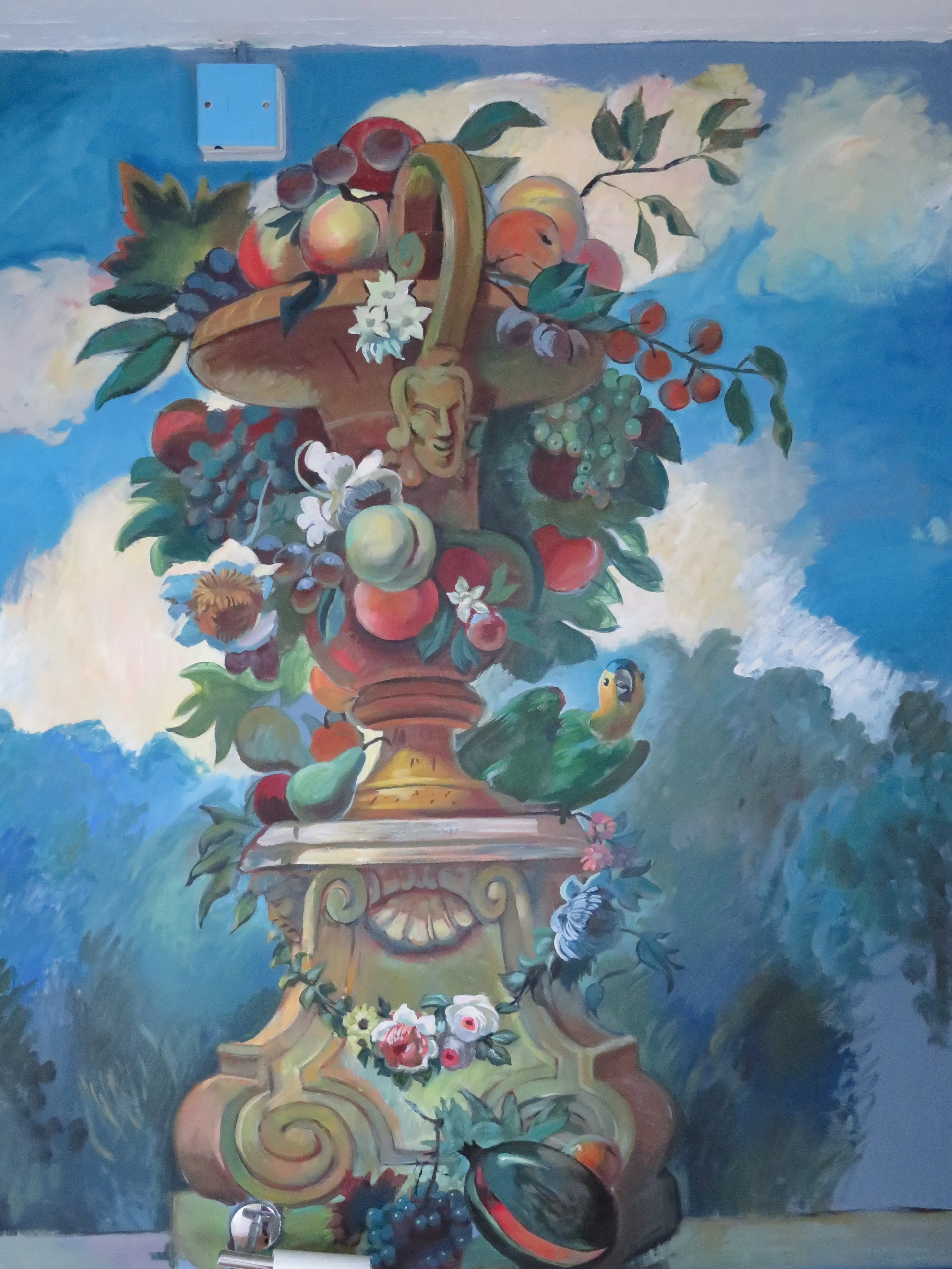Hand-painted fruit mural with birds and flowers