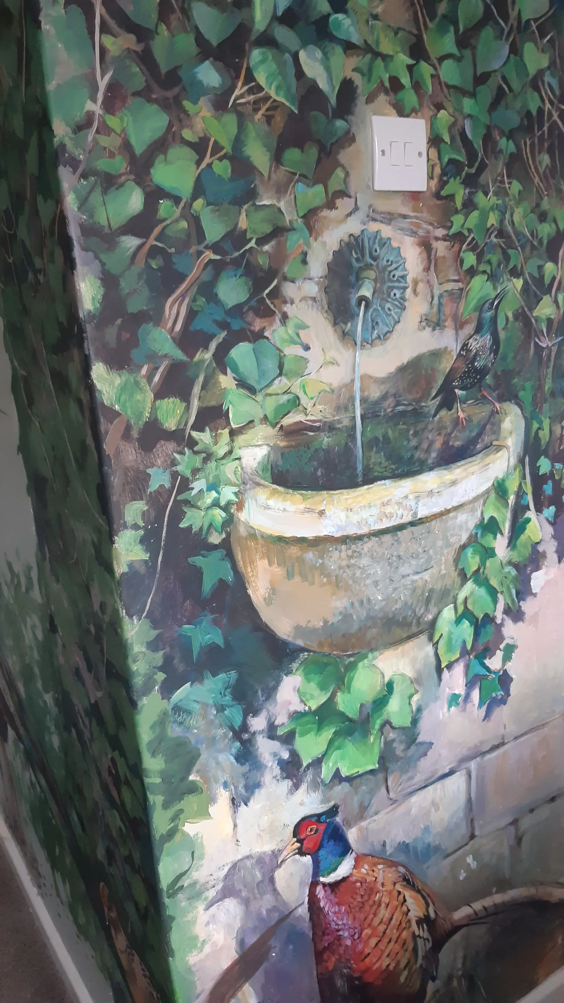 Hand-painted garden mural with birds and a fountain